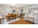 Inviting dining room with hardwood floors, a wooden table, and bar stool seating at 305 Deep Step Rd, Covington, GA 30014