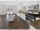 Kitchen featuring a tile backsplash, stainless steel appliances, and an island at 5692 Greensage Dr, Atlanta, GA 30349