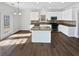 Modern kitchen with white cabinets, stainless steel appliances, and island at 5692 Greensage Dr, Atlanta, GA 30349