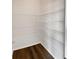 Walk-in pantry with wire shelving and dark wood floor at 5692 Greensage Dr, Atlanta, GA 30349