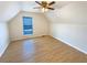 Bedroom with light-colored walls, ceiling fan, and a large window providing natural light at 949 Bobcat Se Ct, Marietta, GA 30067