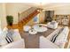 Bright living room with a fireplace, staircase, and neutral-colored furnishings at 949 Bobcat Se Ct, Marietta, GA 30067