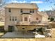 Exterior rear view of house with two-level deck and outdoor seating at 1090 Fountain Head Ln, Lawrenceville, GA 30043