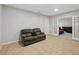 Cozy basement space with tile flooring and a door leading to another finished area at 1090 Fountain Head Ln, Lawrenceville, GA 30043
