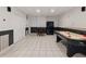 A finished basement game room offers ample space for entertainment at 1090 Fountain Head Ln, Lawrenceville, GA 30043