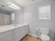 Bright bathroom with white vanity, large mirror, and shower/tub combination at 1090 Fountain Head Ln, Lawrenceville, GA 30043