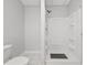 Well-lit bathroom featuring a toilet, walk-in shower, and white fixtures at 1090 Fountain Head Ln, Lawrenceville, GA 30043