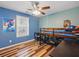 This bedroom is vibrant with a colorful theme, featuring ample natural light from the large window at 1090 Fountain Head Ln, Lawrenceville, GA 30043