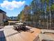 Spacious deck with dining set and comfortable lounge chairs, ideal for relaxation at 1090 Fountain Head Ln, Lawrenceville, GA 30043
