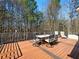 Deck with dining table and chairs; beautiful view of surrounding trees at 1090 Fountain Head Ln, Lawrenceville, GA 30043