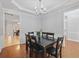 Formal dining room with hardwood floors, wainscoting, and a stylish chandelier at 1090 Fountain Head Ln, Lawrenceville, GA 30043