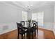 Formal dining room with hardwood floors, wainscoting, and a stylish chandelier at 1090 Fountain Head Ln, Lawrenceville, GA 30043