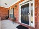 A welcoming front entryway with a classic black door and decorative planters at 1090 Fountain Head Ln, Lawrenceville, GA 30043
