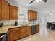 Kitchen with granite countertops, oak cabinets, and modern appliances at 1090 Fountain Head Ln, Lawrenceville, GA 30043