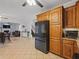 Open kitchen with stainless steel appliances and view into the living room at 1090 Fountain Head Ln, Lawrenceville, GA 30043