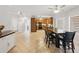 Open-concept kitchen and dining area with tile floors and stainless steel appliances at 1090 Fountain Head Ln, Lawrenceville, GA 30043