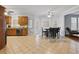 Bright kitchen and dining area with tiled floors and oak cabinets at 1090 Fountain Head Ln, Lawrenceville, GA 30043