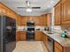 Well-equipped kitchen featuring granite countertops and modern stainless steel appliances at 1090 Fountain Head Ln, Lawrenceville, GA 30043