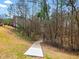 A concrete path through the trees offers a secluded retreat for residents at 1090 Fountain Head Ln, Lawrenceville, GA 30043