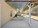 Covered patio with concrete flooring, a ceiling fan, and view to backyard play area at 1090 Fountain Head Ln, Lawrenceville, GA 30043