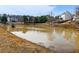 Picturesque pond nestled in the community providing a serene setting for relaxation at 1090 Fountain Head Ln, Lawrenceville, GA 30043