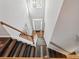 Aerial view of the staircase, highlighting the wood and white railing to the front door at 1090 Fountain Head Ln, Lawrenceville, GA 30043