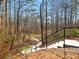 Steps along a walking path with a metal railing offering access to the community's natural beauty at 1090 Fountain Head Ln, Lawrenceville, GA 30043