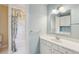 Bathroom featuring a shower and tub, a single vanity with silver hardware, and light blue walls at 2850 Brandy Ln, Cumming, GA 30041