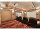 Luxurious home theater with leather seating, projector, and large screen for immersive entertainment at 2850 Brandy Ln, Cumming, GA 30041