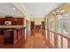 Open concept living area featuring hardwood floors, fireplace, and seamless access to the kitchen at 2850 Brandy Ln, Cumming, GA 30041