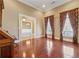 Spacious living room with hardwood floors and view to the dining room at 2850 Brandy Ln, Cumming, GA 30041