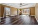 Large bedroom with tray ceilings, wood floors and lots of natural light at 2850 Brandy Ln, Cumming, GA 30041