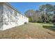 View of the home's backyard with mature trees and green space, showcasing the property's outdoor space at 10152 Griffin Sw Ln, Covington, GA 30014