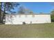 View of the home's backyard with mature trees and green space, showcasing the property's outdoor space at 10152 Griffin Sw Ln, Covington, GA 30014