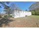 View of the home's backyard with mature trees and green space, showcasing the property's outdoor space at 10152 Griffin Sw Ln, Covington, GA 30014