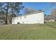 View of the home's backyard with mature trees and green space, showcasing the property's outdoor space at 10152 Griffin Sw Ln, Covington, GA 30014