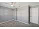 Inviting bedroom with updated gray walls, plush carpeting, and a convenient closet for ample storage at 10152 Griffin Sw Ln, Covington, GA 30014