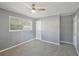 Comfortable bedroom with ample natural light, updated gray walls, and cozy carpeting for a peaceful ambiance at 10152 Griffin Sw Ln, Covington, GA 30014