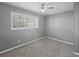Cozy bedroom featuring neutral gray walls and plush carpeting for a serene and inviting atmosphere at 10152 Griffin Sw Ln, Covington, GA 30014