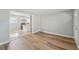 Bright living room featuring tile flooring that flows into an open concept kitchen at 10152 Griffin Sw Ln, Covington, GA 30014