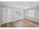 Inviting living room with beautiful hardwood floors, natural light, and a fresh coat of paint at 10152 Griffin Sw Ln, Covington, GA 30014