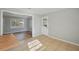 Cozy living room featuring neutral paint, hardwood floors, and bright natural light at 10152 Griffin Sw Ln, Covington, GA 30014