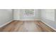 Inviting living room with beautiful hardwood floors, natural light, and a fresh coat of paint at 10152 Griffin Sw Ln, Covington, GA 30014
