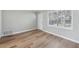 Inviting living room with beautiful hardwood floors, natural light, and a fresh coat of paint at 10152 Griffin Sw Ln, Covington, GA 30014