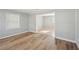 Bright living room featuring tile flooring that flows into an open concept kitchen at 10152 Griffin Sw Ln, Covington, GA 30014