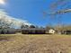 Expansive backyard featuring a brick home with a deck and a large, sunny outdoor space at 1091 Mountain View Nw Rd, Conyers, GA 30012