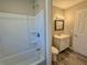 Cozy bathroom showcasing a tub and shower combination, plus modern fixtures at 1091 Mountain View Nw Rd, Conyers, GA 30012