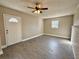 Spacious bedroom with a ceiling fan, a window and gray vinyl floors at 1091 Mountain View Nw Rd, Conyers, GA 30012