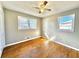 Bedroom with two windows and hardwood floors for comfortable living at 1091 Mountain View Nw Rd, Conyers, GA 30012