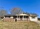 Charming single-story home with brick accents, a covered porch, and a well-maintained front yard at 1091 Mountain View Nw Rd, Conyers, GA 30012